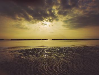 Scenic view of sea against sky at sunset