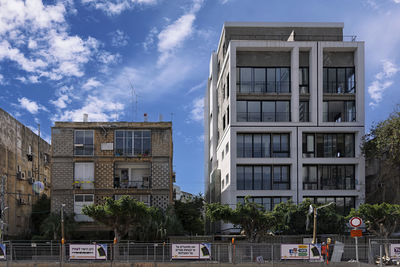 Buildings in city against sky