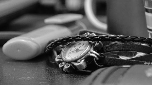 Close-up of clock on table