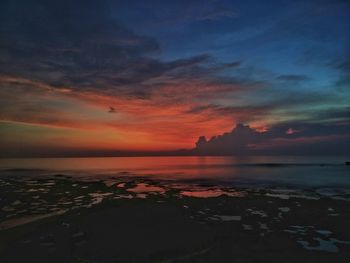 Scenic view of sea against dramatic sky