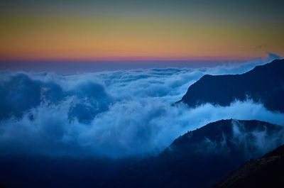 Scenic view of mountains against sky during sunset