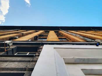 Low angle view of building against blue sky