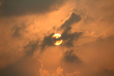 Low angle view of moon against sky at sunset