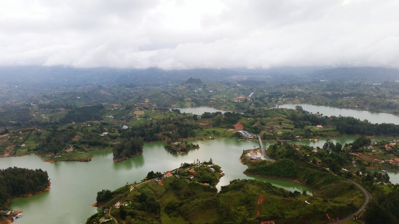 SCENIC VIEW OF LAKE AND CITYSCAPE AGAINST SKY