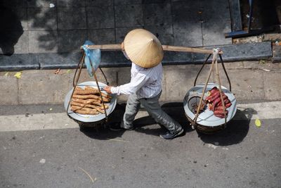 High angle view of man selling food on street