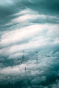 Low angle view of communications tower against sky