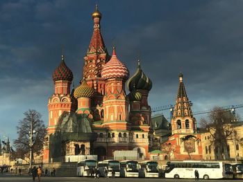 Cathedral of buildings against sky in city