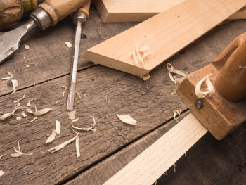 Close-up of wood shavings on table at workshop