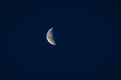 Low angle view of moon against sky at night
