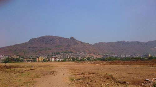 Landscape with mountain range in background