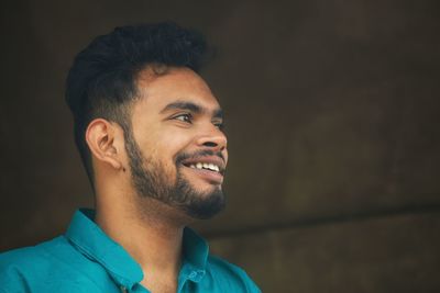 Close-up of young man looking away