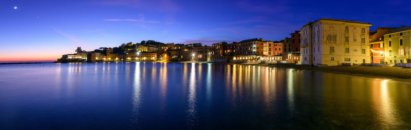 Illuminated buildings at waterfront