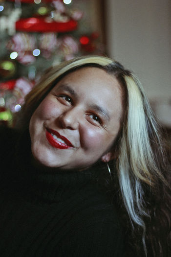 Close-up of smiling woman looking away