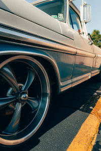 Close-up of vintage car on street