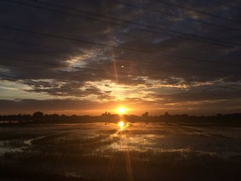 Scenic view of dramatic sky over landscape