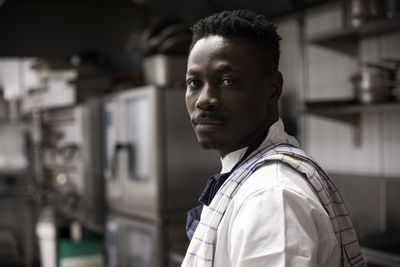 Portrait of confident chef in kitchen of restaurant