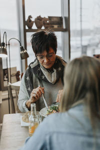 Woman having meal in cafe