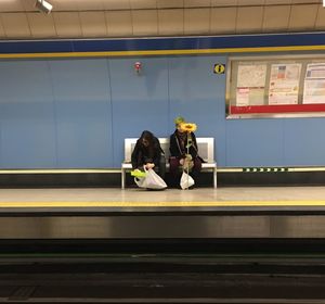 People waiting at railroad station