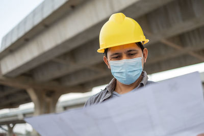 Portrait of man working at construction site