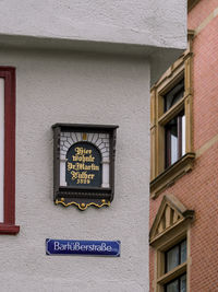 Information sign on wall of building