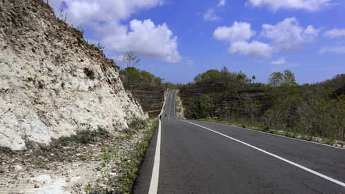 Surface level of empty road against sky