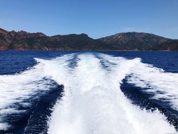 Scenic view of sea against clear blue sky