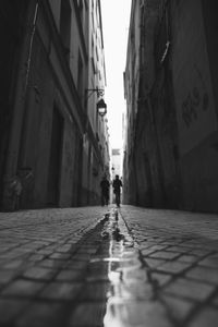 Narrow street along buildings