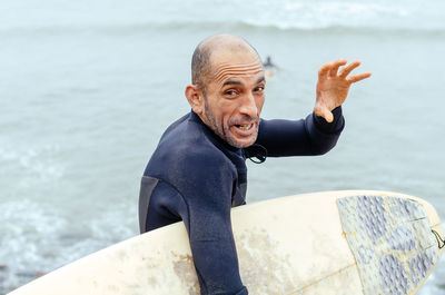 Portrait of man sitting in sea