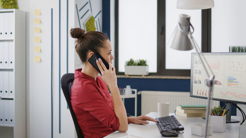 Young businesswoman working at office