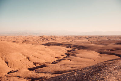 Scenic view of desert against clear sky