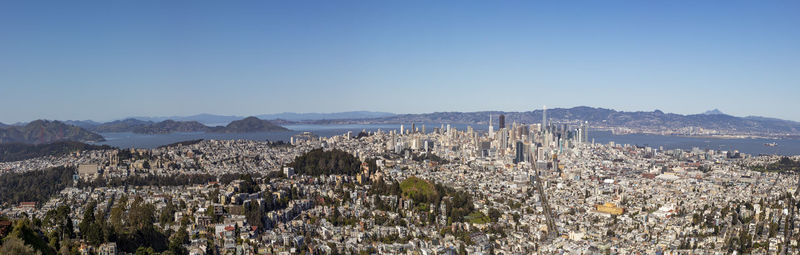 High angle view of townscape against clear blue sky