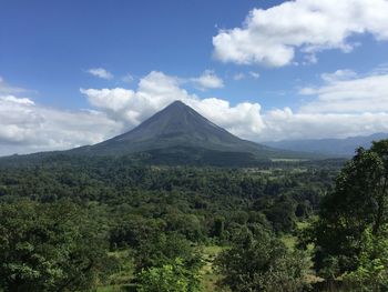 Scenic view of landscape against cloudy sky