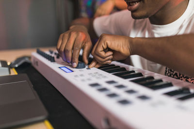 Close-up of man playing guitar