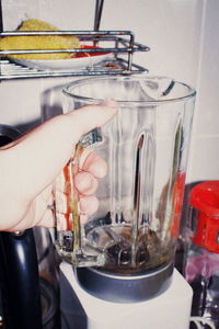 Close-up of person preparing food in glass