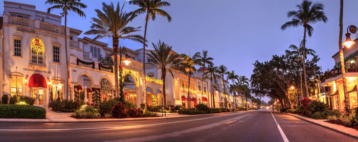 Christmas lights as sunrises over the french restaurant along 5th street in old naples, florida.