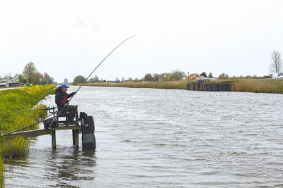 Man fishing in lake