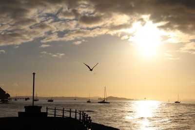 Scenic view of sea against cloudy sky