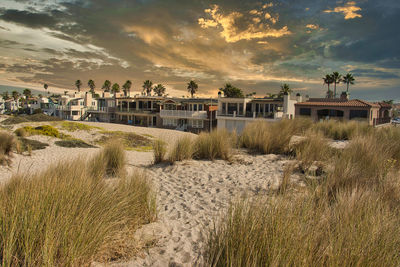 Panoramic shot of beach against sky during sunset