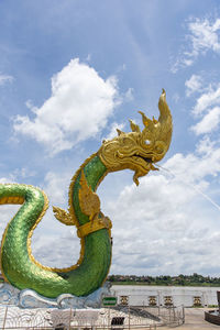 Low angle view of statue against sky