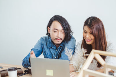 Young couple looking at camera