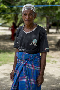 Portrait of man standing outdoors