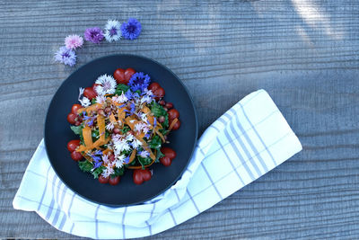 High angle view of flowers in bowl on table