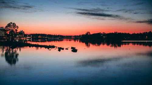 Scenic view of lake against sky during sunset