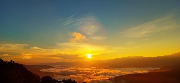 Scenic view of mountains against sky during sunset