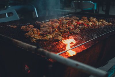 Close-up of meat on barbecue grill