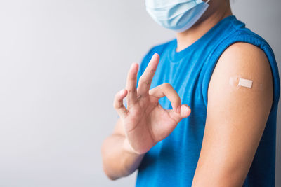 Midsection of man against white background