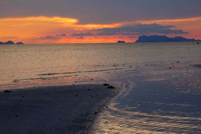 Scenic view of sea against orange sky