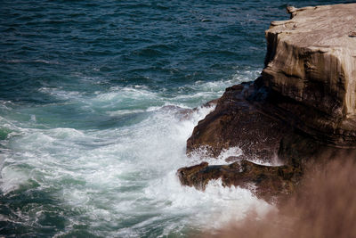 High angle view of rocks in sea