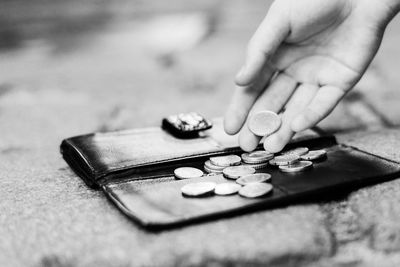 Cropped hands of woman playing jigsaw puzzle on table