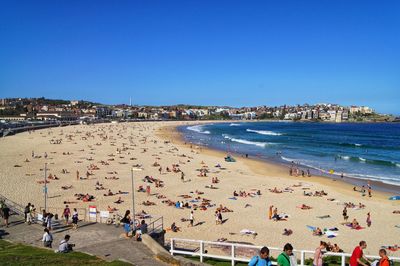 High angle view of people at beach against sky